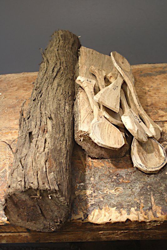 Grapevine log and treenware pieces 
		roughed out from it.