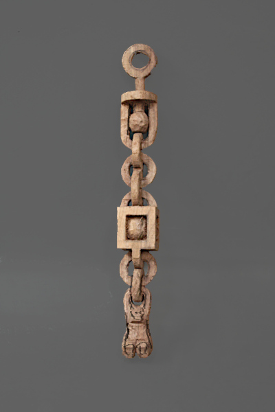 Roughed out components of chain with centers 
		carved out.